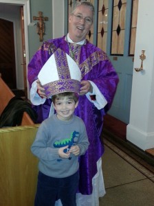 young parishioner with bishop